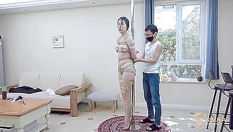 Tied to a pole with dildo gag Tied to a pole with dildo gag