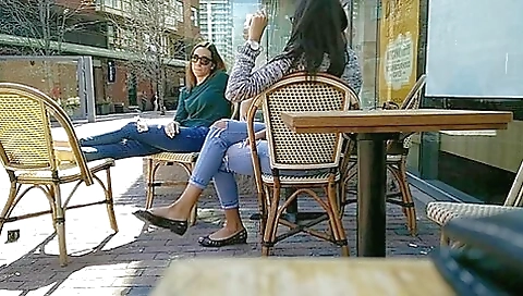 Two Delicious Brunettes Get Their Candid Feet Filmed At The Caffe